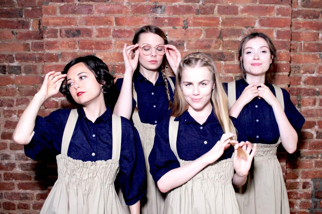 four ladies wearing uniform