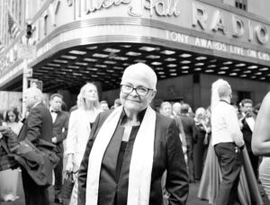 A Man Standing in Front of a Theater